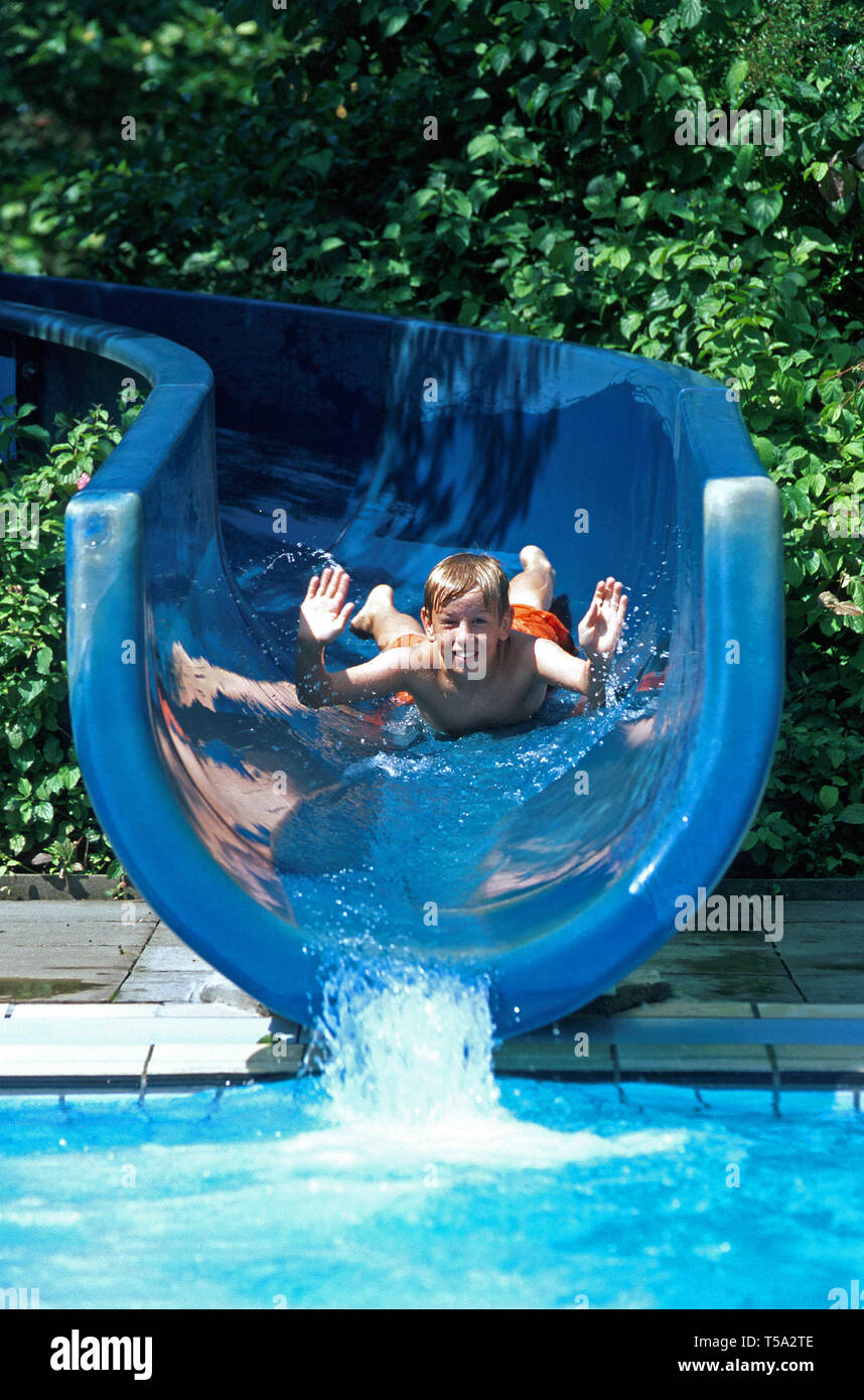 favdolls racje boy on a water slide Stock Photo - Alamy