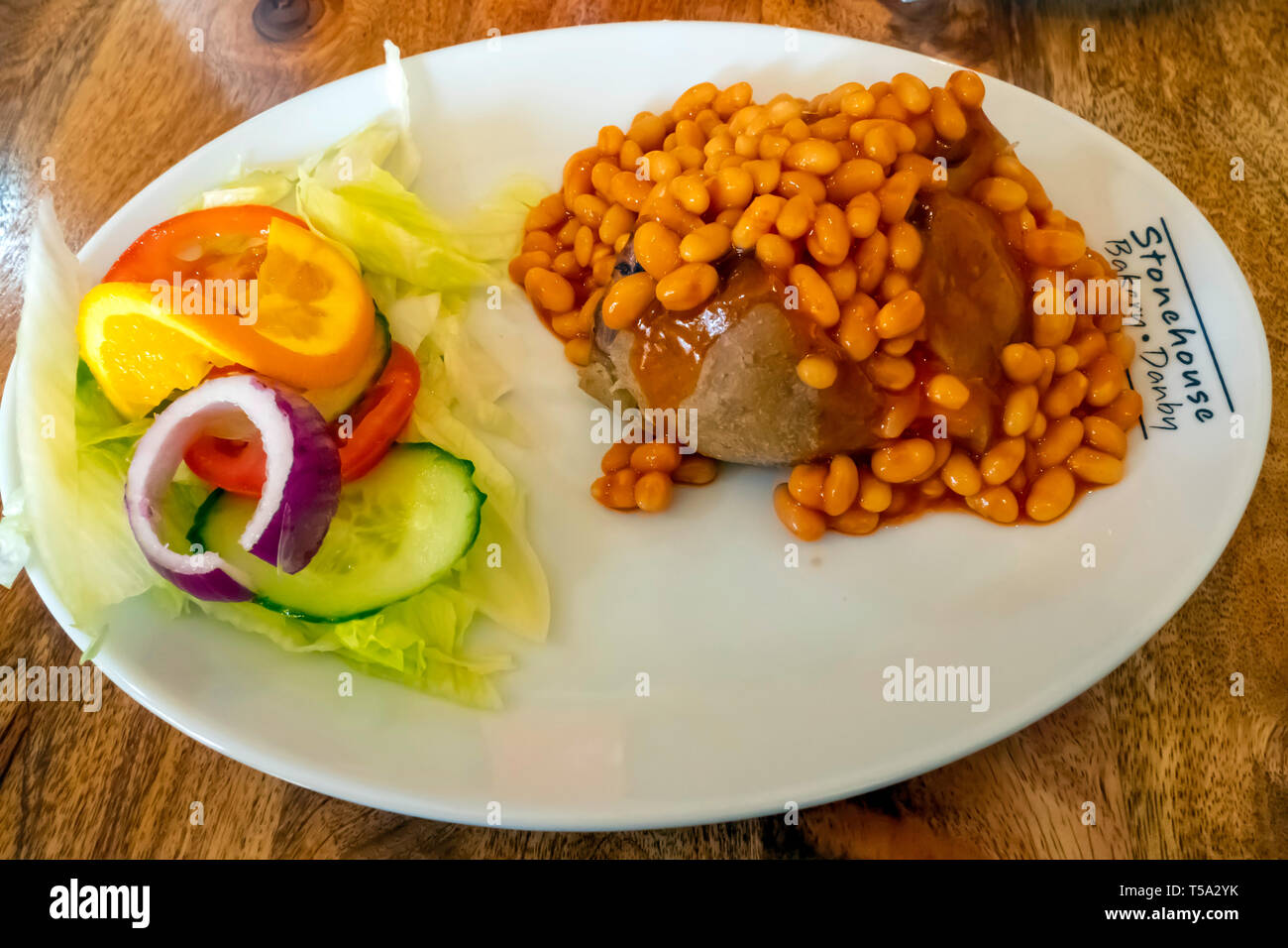 Cheap wholesome lunch jacket potato baked beans and salad at the