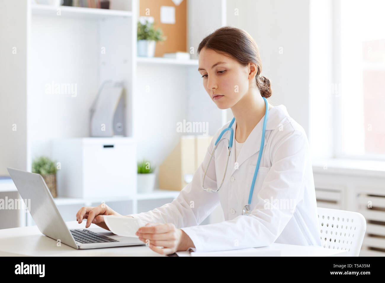 Obstetrician Working at Desk Stock Photo - Alamy