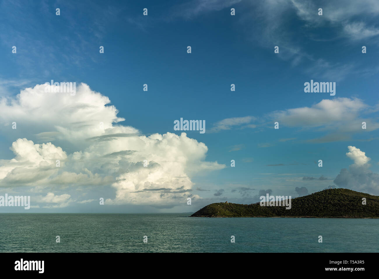 Thursday Island, Australia - February 20, 2019: Wide shot of dark green rainforets covered Goods Island, part of Torres Strait Islands Archipelago und Stock Photo