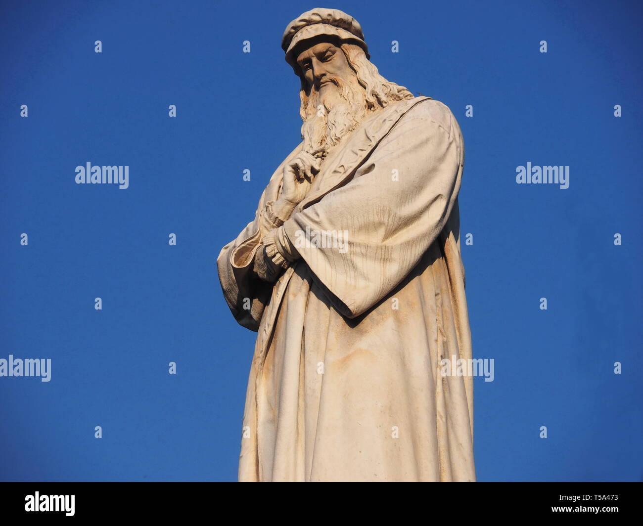 Leonardo Da Vinci sculpture in Piazza della Scala square, Milan. Stock Photo