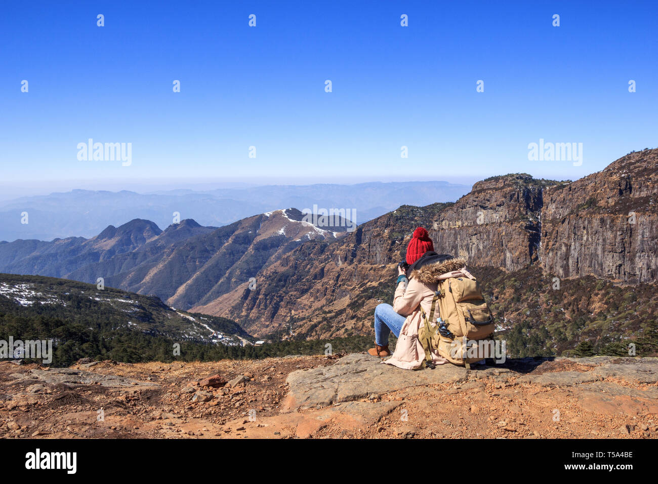 Girl sitting on high hill hi-res stock photography and images - Alamy
