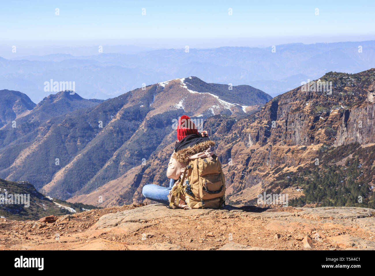 Girl sitting on high hill hi-res stock photography and images - Alamy