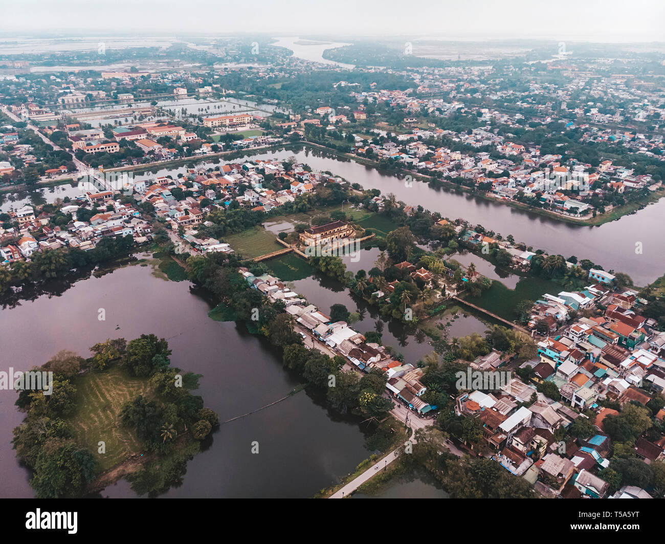 The city of hue in the mist of Vietnam. The view from the top. Aerial view. Rainy season, winter. lake in the city centre of hue Stock Photo