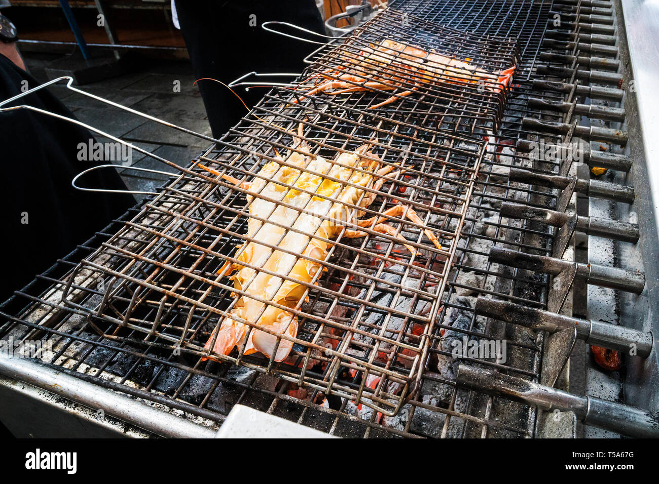 Freshly grilled delicious lobsters. Lobster bbq. Street food Stock