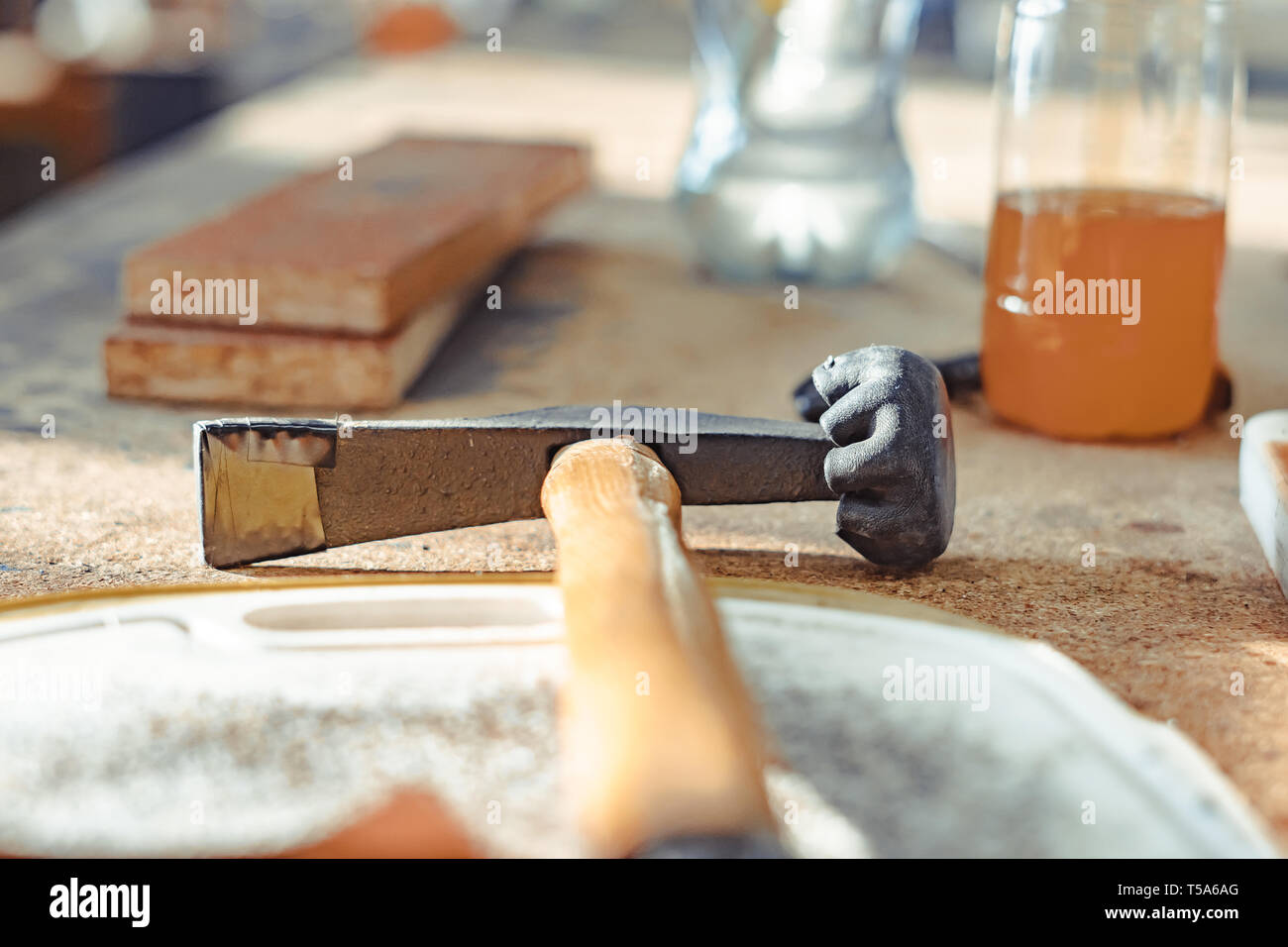 Repair modern tools: rubber hummer on dark stone background, top view, copy space Stock Photo