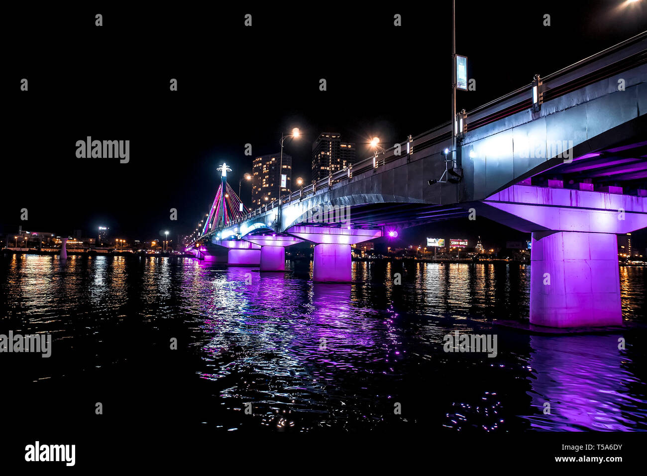 Han River Bridge and the Thuan Phuoc Bridge at night flamboyance on the Han River. Night view of Danang. Vietnam Stock Photo