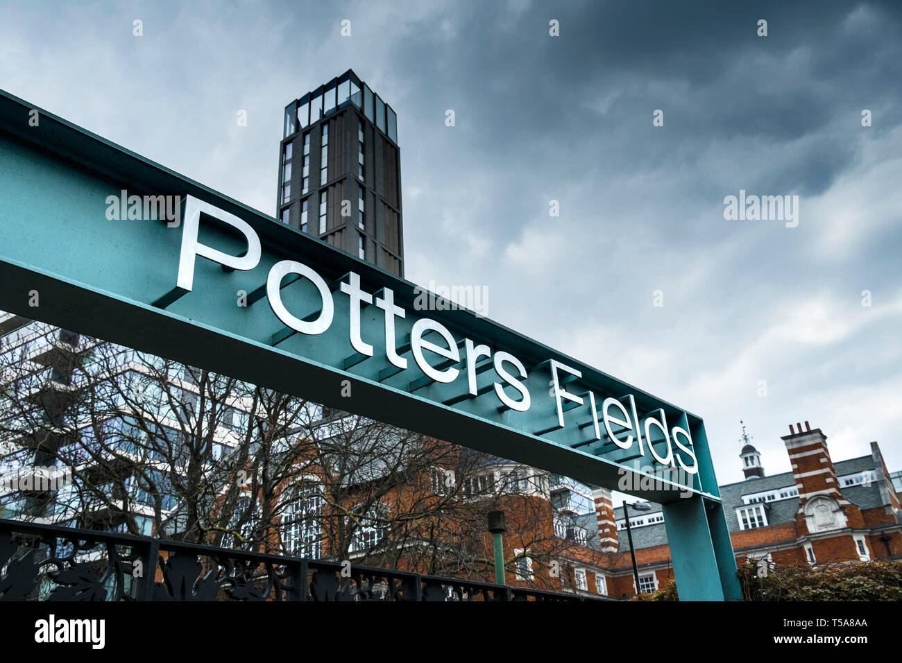 The metal sign above an entrance to Potters Fields in London. Stock Photo