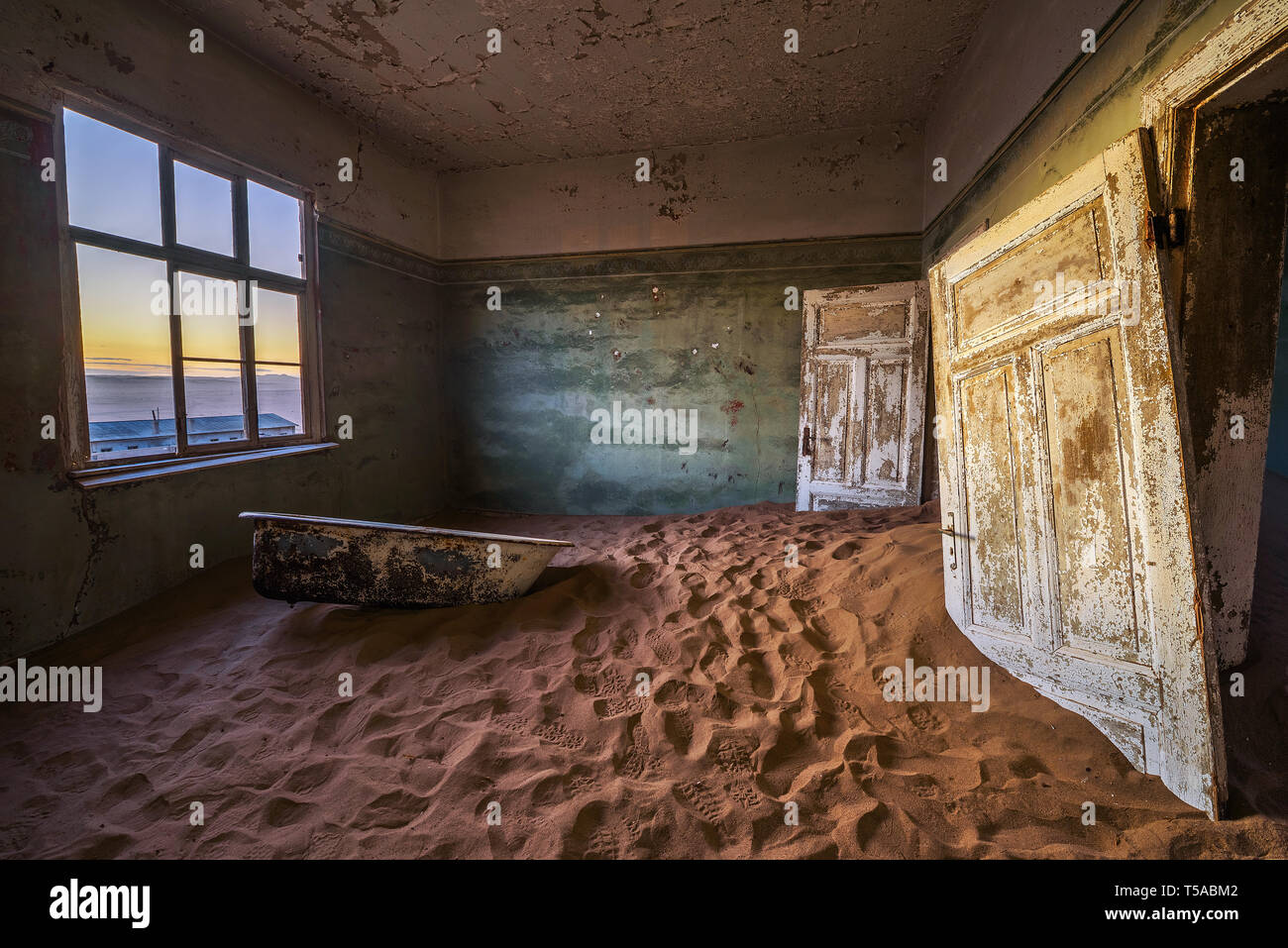 Ruins of the mining town Kolmanskop in the Namib desert near Luderitz in Namibia Stock Photo