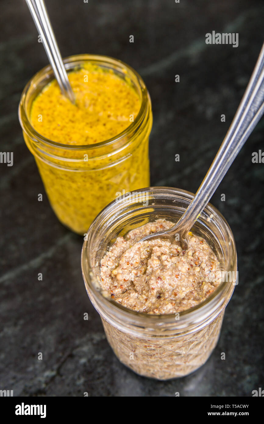 Home-canned yellow mustard and a Bavarian sweet mustard Stock Photo