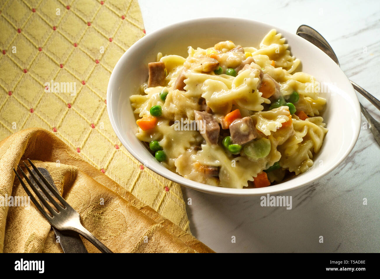 Chicken pot pie pasta casserole with mixed vegetables and bowtie