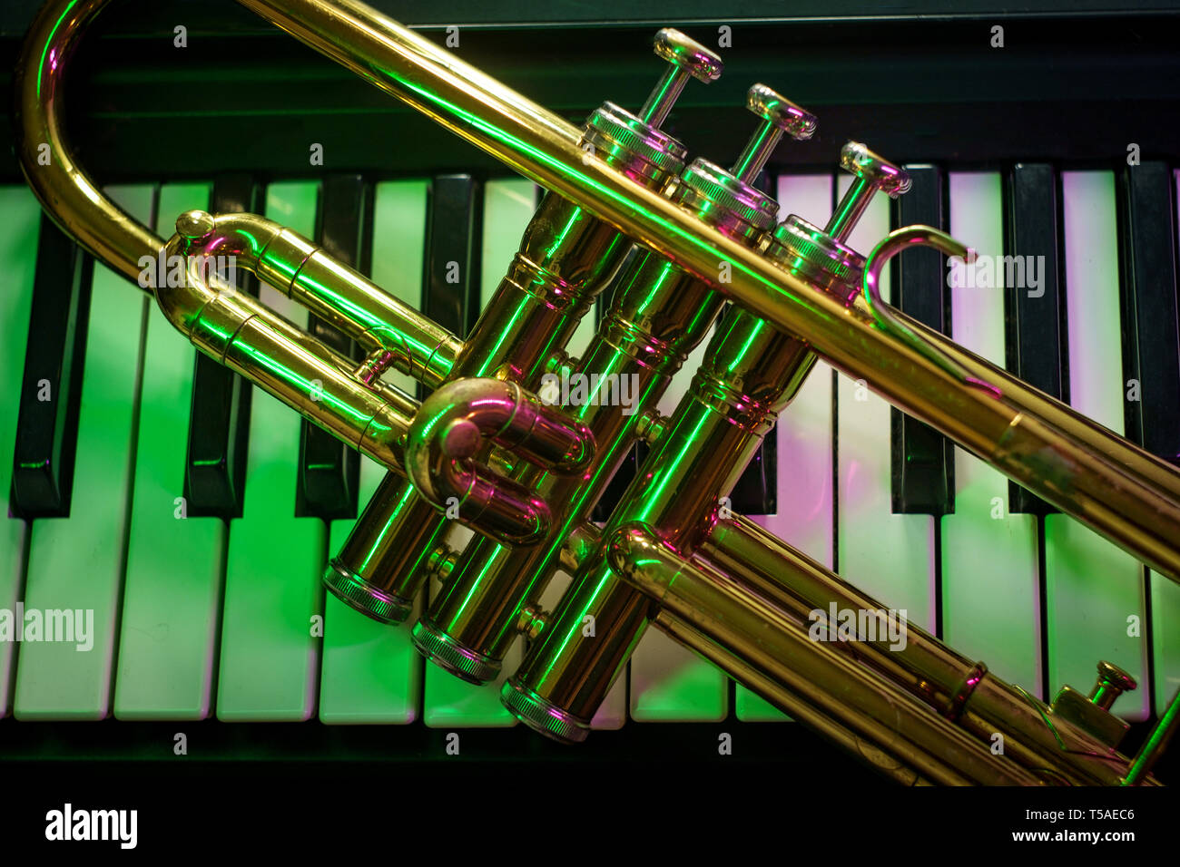 Old and worn Jazz trumpet and piano keyboard musical show and