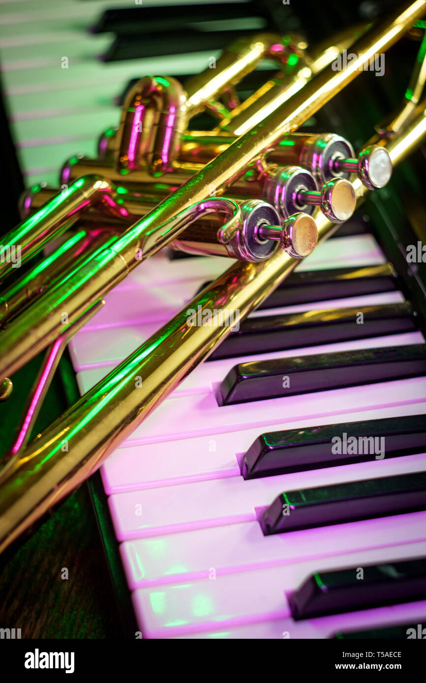 Old and worn Jazz trumpet and piano keyboard musical show and