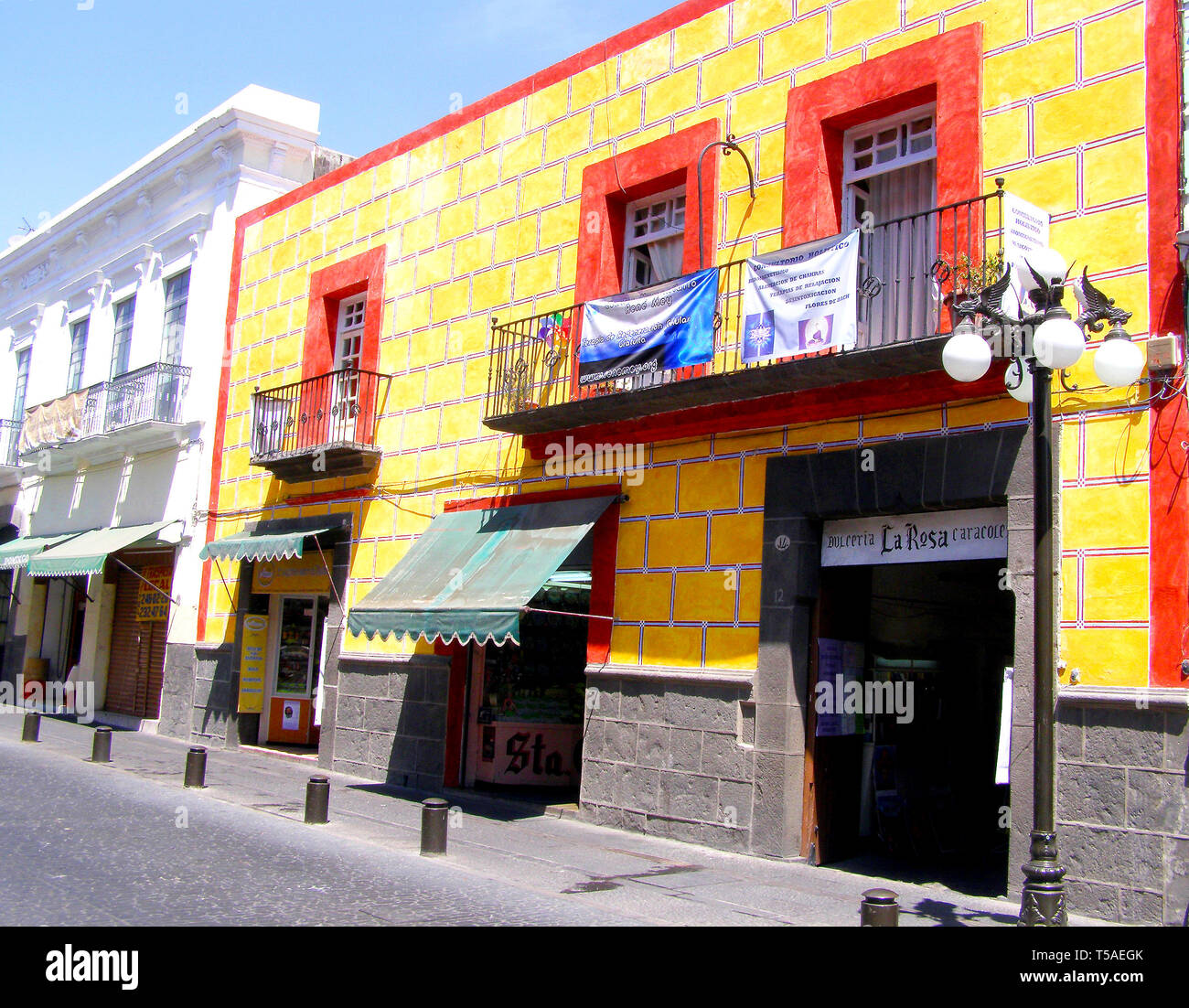 MERIDA, MEXICO 11 th March 2016: Street scene with colorful traditional old houses on street in Merida on hot sunny day. Big colonial city in Yucatan, Stock Photo