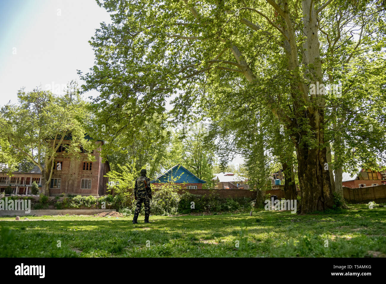 An Indian paramilitary man seen standing on guard outside the polling station in Anantnag, South Kashmir. On the third phase of India's Parliamentary elections, Indians went to polls amid complete shut down and internet gag. Stock Photo