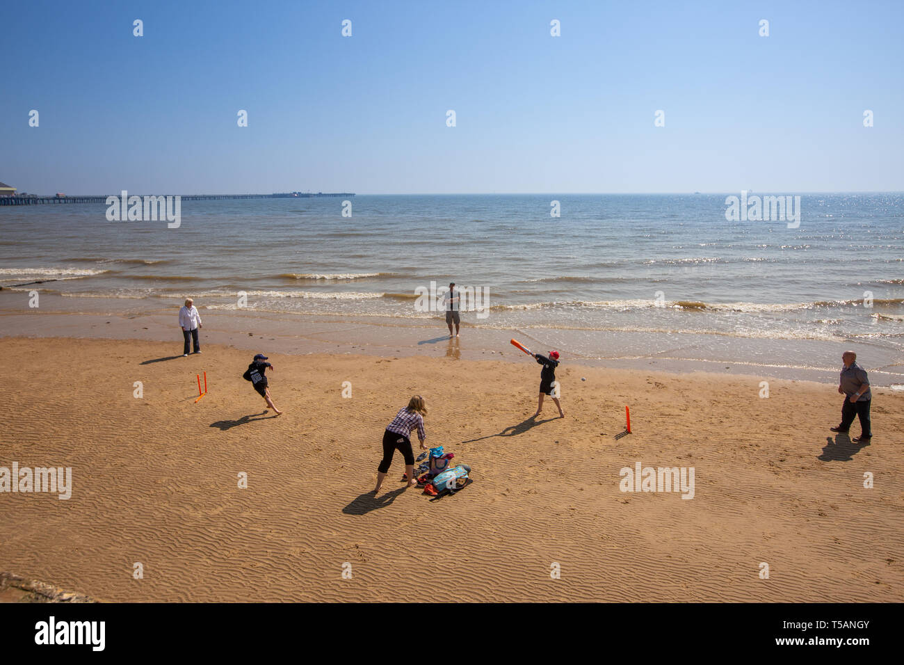 Picture dated April 21st shows people out on the beach playing cricket in Walton-on-the-Naze,Essex,on Easter Sunday afternoon and making the most on the hot weather. Stock Photo