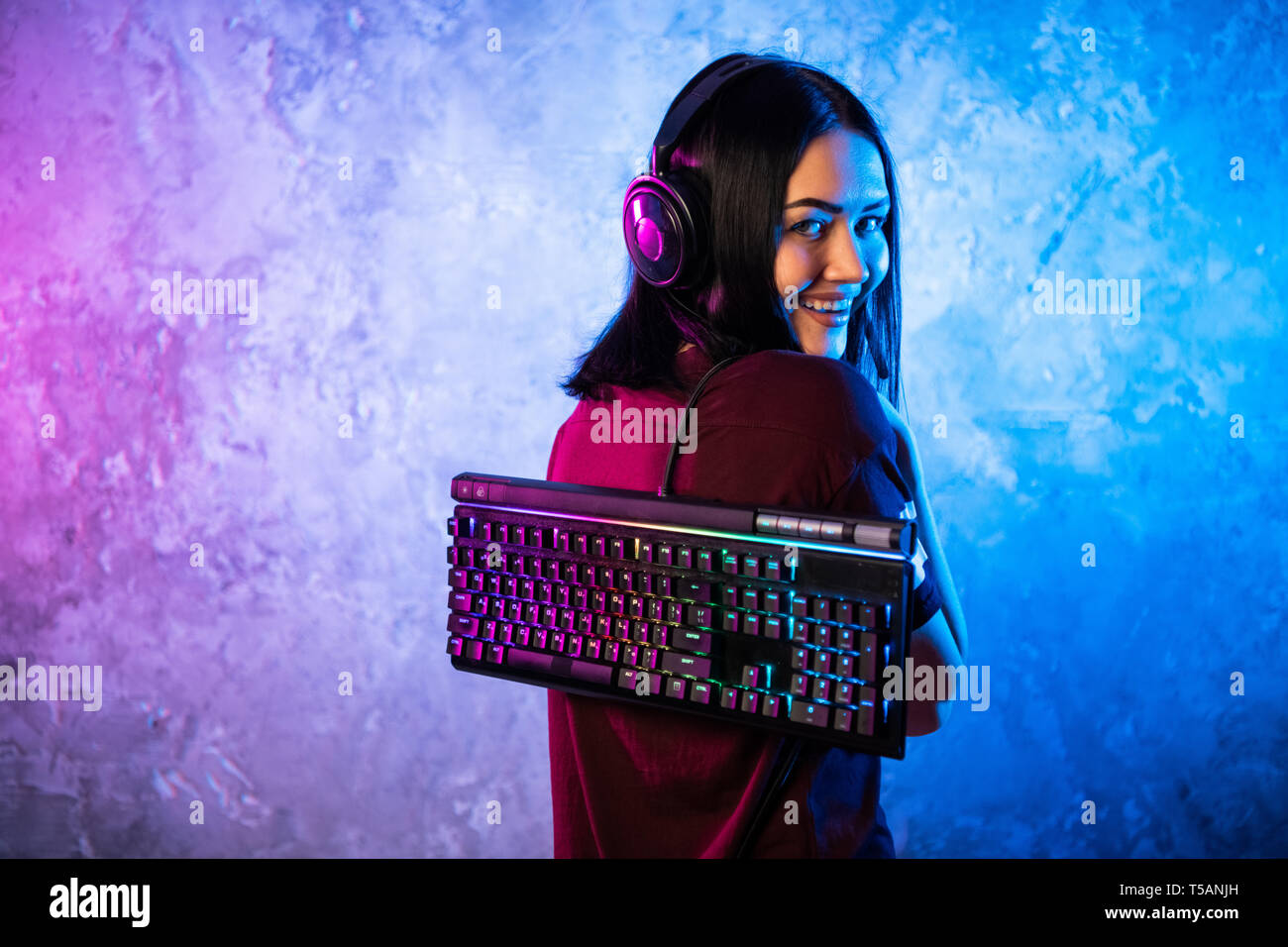 Funny nerd gamer girl posing with gaming keyboard, playing computer games  Stock Photo - Alamy