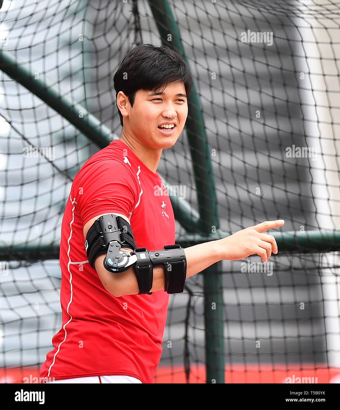 Los Angeles Angels' Shohei Ohtani wears an elbow brace during base running  drills before the Major League Baseball game against the Seattle Mariners  at Angel Stadium in Anaheim, California, United States, April