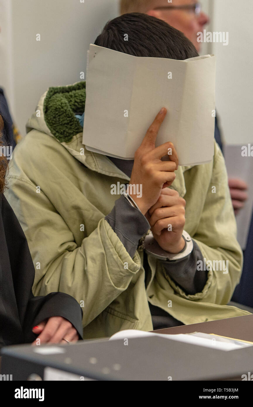 Amberg, Germany. 23rd Apr, 2019. One in four defendants is sitting in the courtroom of the district court. Four young refugees have to answer in court because at the end of last year they allegedly attacked indiscriminately passers-by in the city centre of Amberg. Credit: Armin Weigel/dpa - ATTENTION: person(s) was/are pixelated for legal reasons/dpa/Alamy Live News Stock Photo