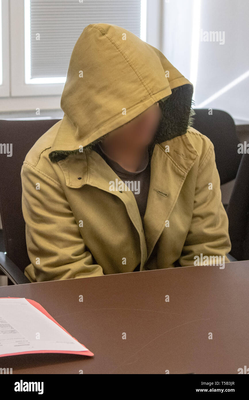 Amberg, Germany. 23rd Apr, 2019. One in four defendants is sitting in the hearing room of the District Court of Amberg. Four young refugees have to answer in court because at the end of last year they allegedly attacked indiscriminately passers-by in the city centre of Amberg. Credit: Armin Weigel/dpa - ATTENTION: person(s) was/are pixelated for legal reasons/dpa/Alamy Live News Stock Photo