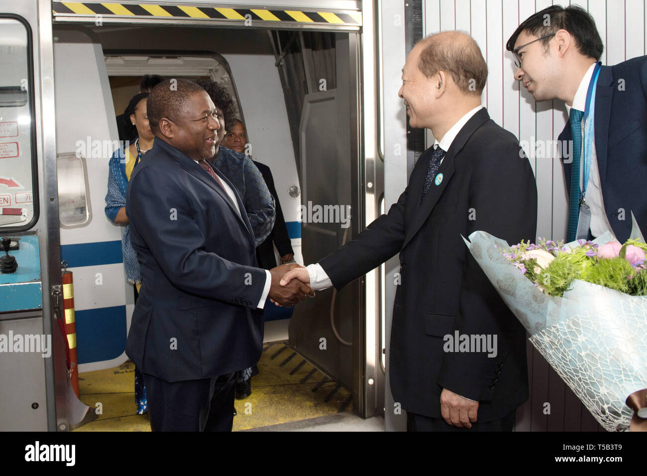 Beijing, China. 23rd Apr, 2019. Mozambican President Filipe Nyusi (L) arrives in Beijing, capital of China, April 23, 2019, to attend the second Belt and Road Forum for International Cooperation (BRF). Credit: Ju Huanzong/Xinhua/Alamy Live News Stock Photo