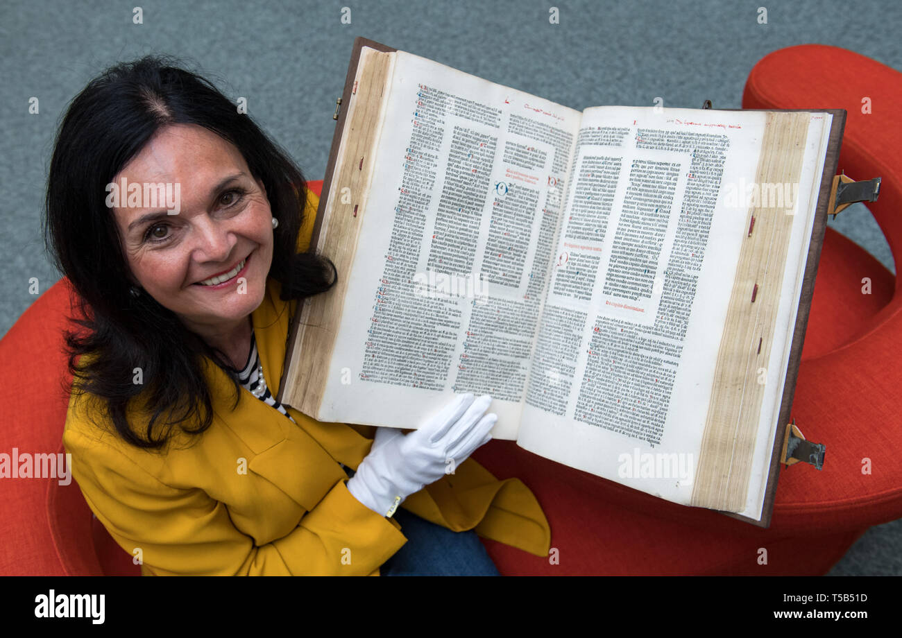 23 April 2019, Saxony, Chemnitz: Elke Beer, Director of the Chemnitz City Library, shows the restored Consilia des Nicolaus Panormitanus de Tudeschis in the Chemnitz City Library. The heavily damaged book has now been restored and saved from decay for around 1500 euros. The collection of legal documents and legal opinions was printed 543 years ago in movable type in Ferrara, Rome and Venice. The printed sheets then crossed the Alps to Leipzig. There the bows were bound into folios and henceforth enriched the library of the Chemnitz Franciscan monastery. Presumably there are only four editions  Stock Photo