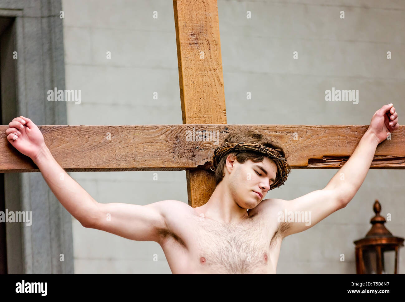 A member of the St. Dominic Youth Group re-enacts the Stations of the Cross during a Good Friday procession, April 19, 2019, in Mobile, Alabama. Stock Photo