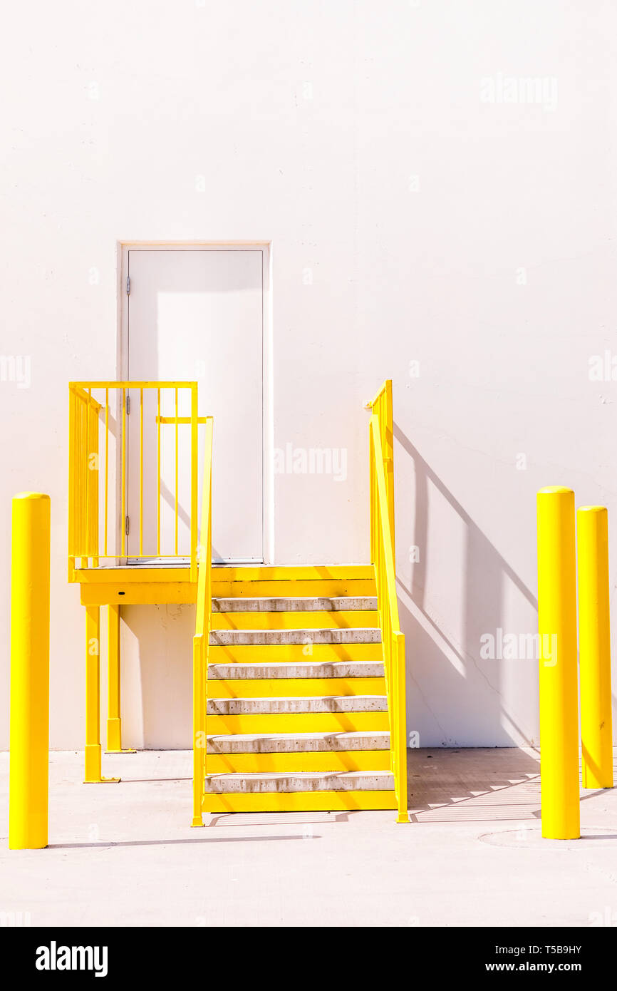 Bright yellow staircase and a white wall Stock Photo