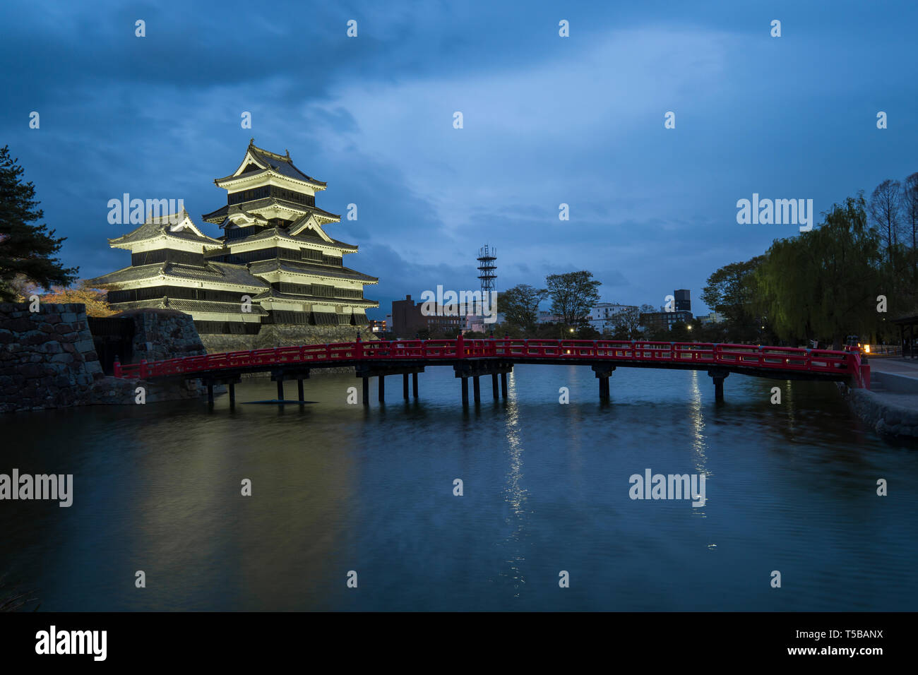 Matsumoto Castle with the red bridge at night in Matsumoto, Japan. Stock Photo
