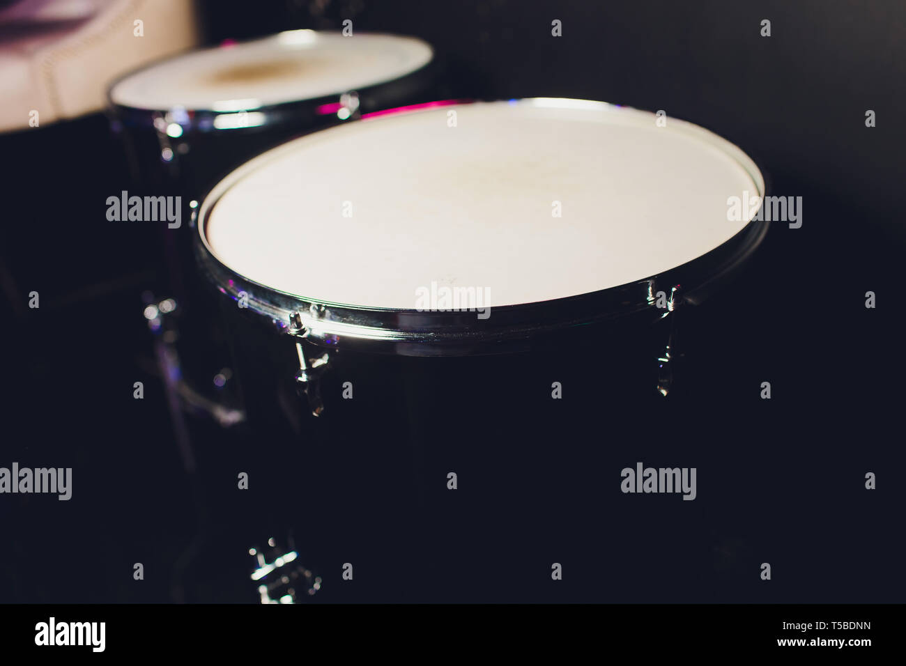 drum set on dark background. Percussion instruments at a concert. Drum