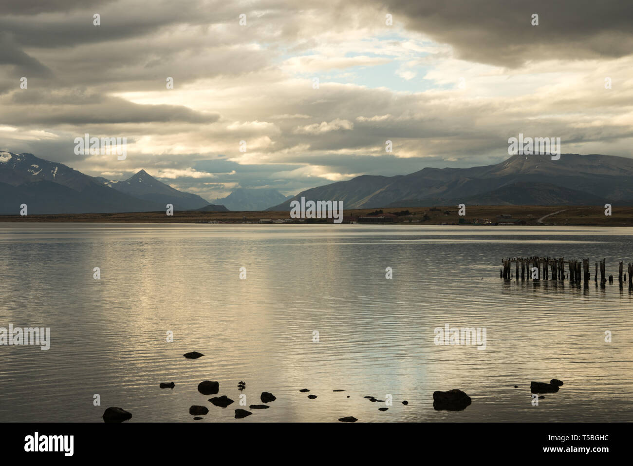 Evening light over the tranquil waters of the Señoret Channel, Puerto Natales, Patagonia, Chile Stock Photo