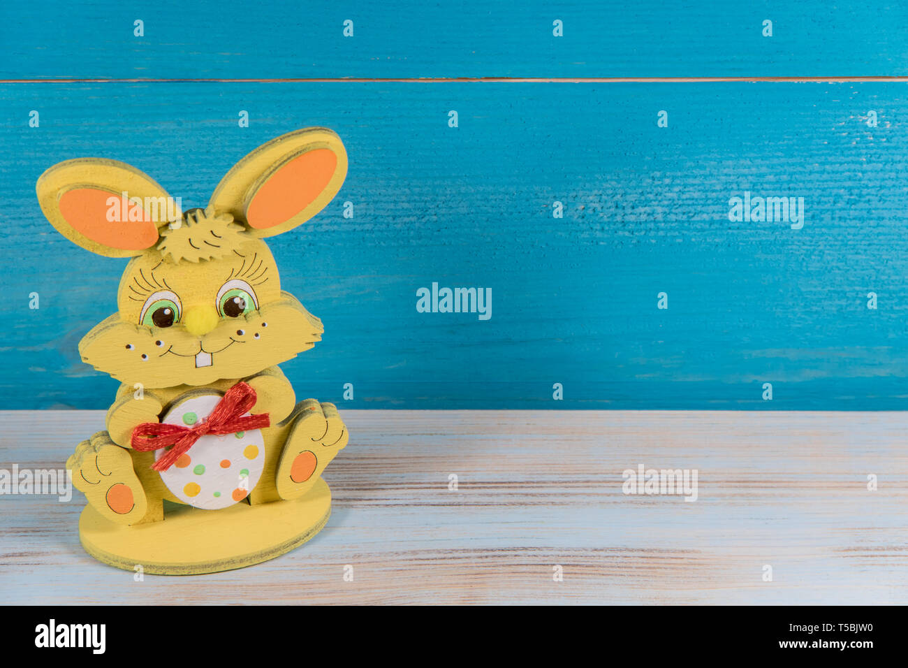 Easter toy bunny on blue background, Easter concept Stock Photo
