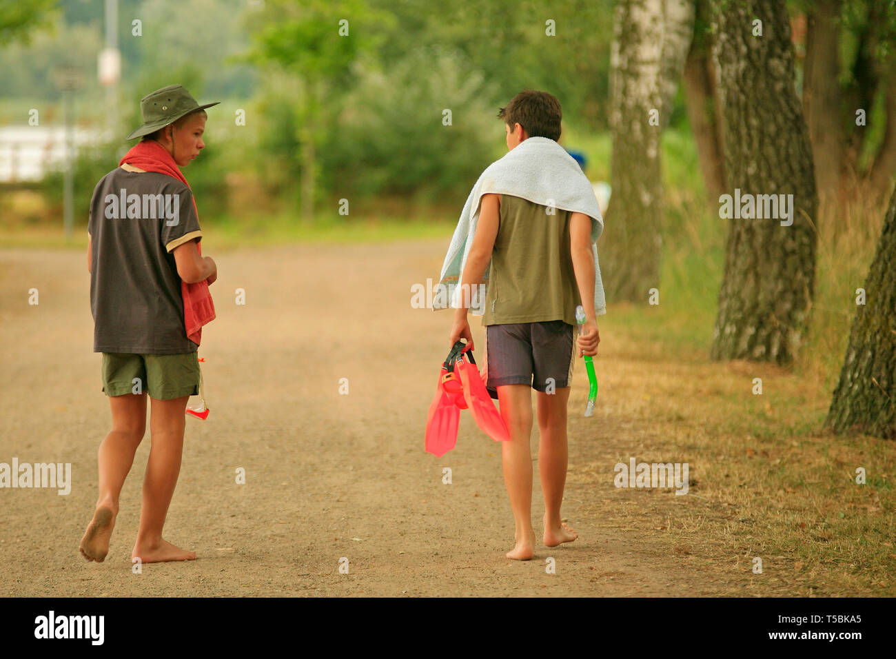 barefoot boys walking to a lake Stock Photo - Alamy