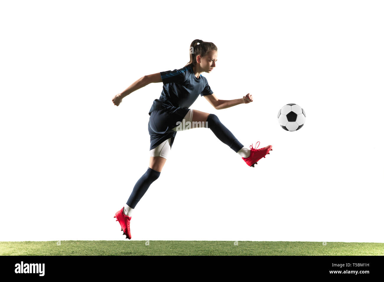Young Female Football Or Soccer Player With Long Hair In Sportwear