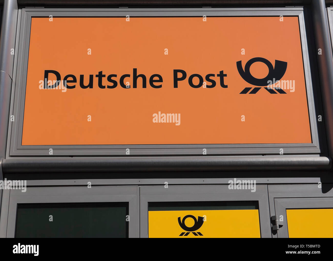 Sign at the entrance of a branch of Deutsche Post, Postbank, DHL in