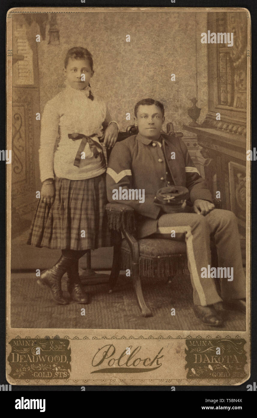 Full-length Portrait of African American Soldier in Uniform, Sitting next to Girl, by Albert Pollock, William A. Gladstone Collection of African American Photographs, between 1877 and 1890 Stock Photo
