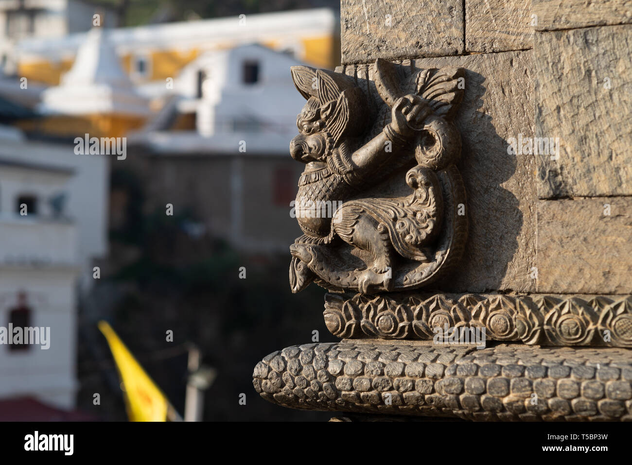 One of the numerous sculpture (representing Garuda) ornementing the small temples protecting Shiva lingam at the Pashupatinath temple Stock Photo