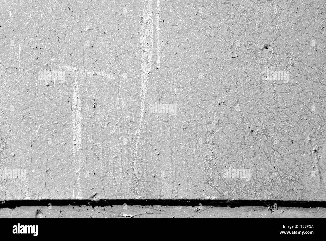 Old painted wall background texture close up. Black and white Stock Photo