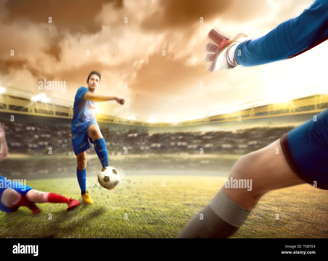 Asian football player man sliding tackle the ball from his opponent