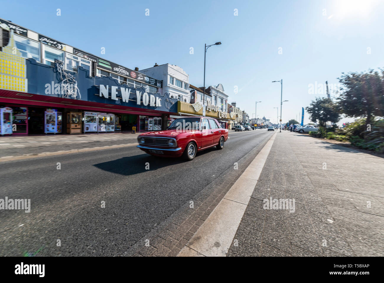 Ford Cortina II classic car at Southend on Sea, Essex, seafront on a sunny day. Driving along Marine Parade passing New York arcade Stock Photo