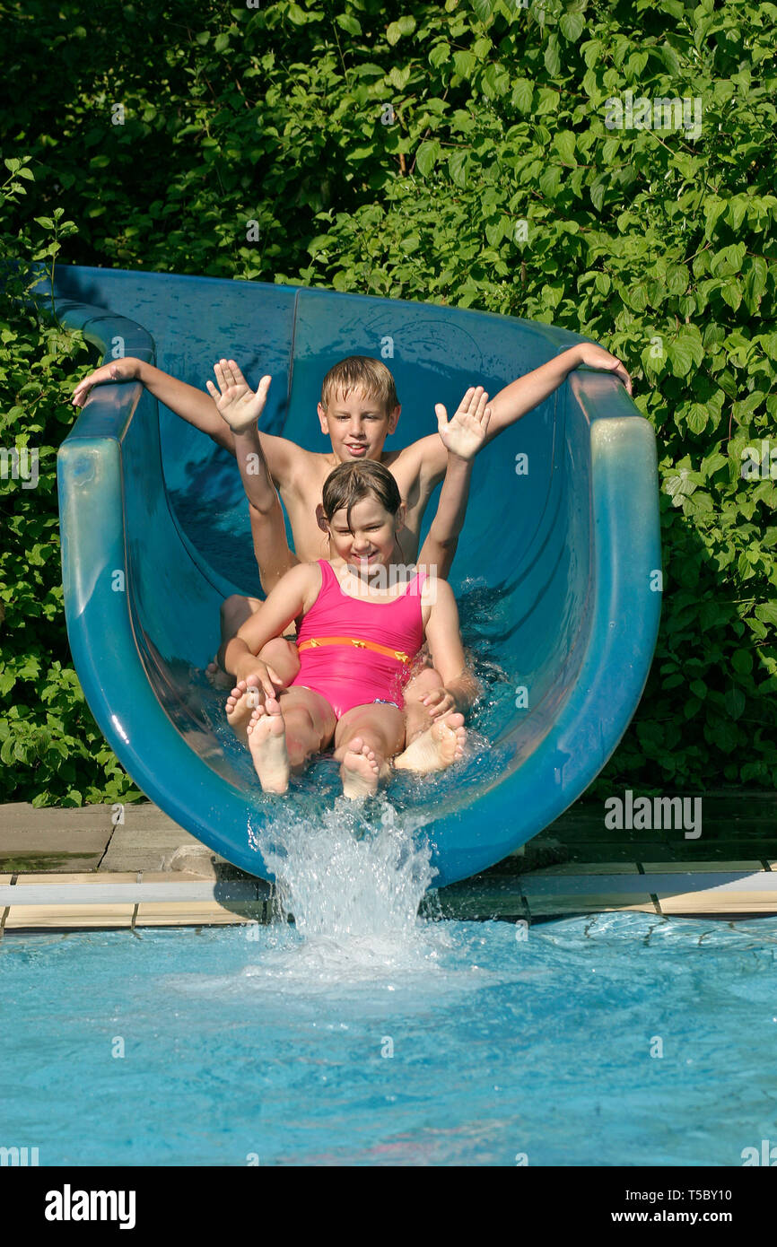 children on water slide Stock Photo Alamy