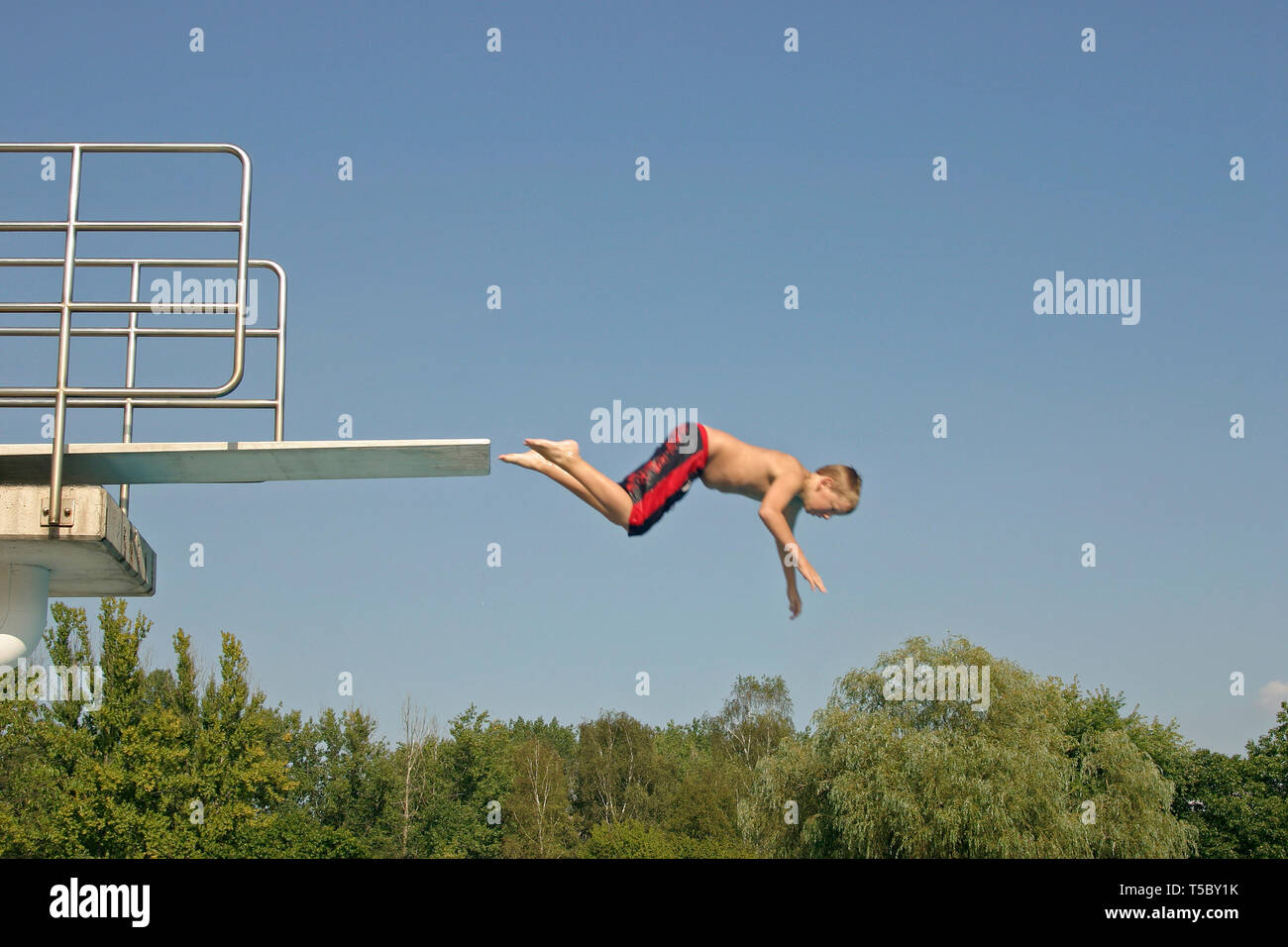 Kid Jumping Diving Board High Resolution Stock Photography and Images
