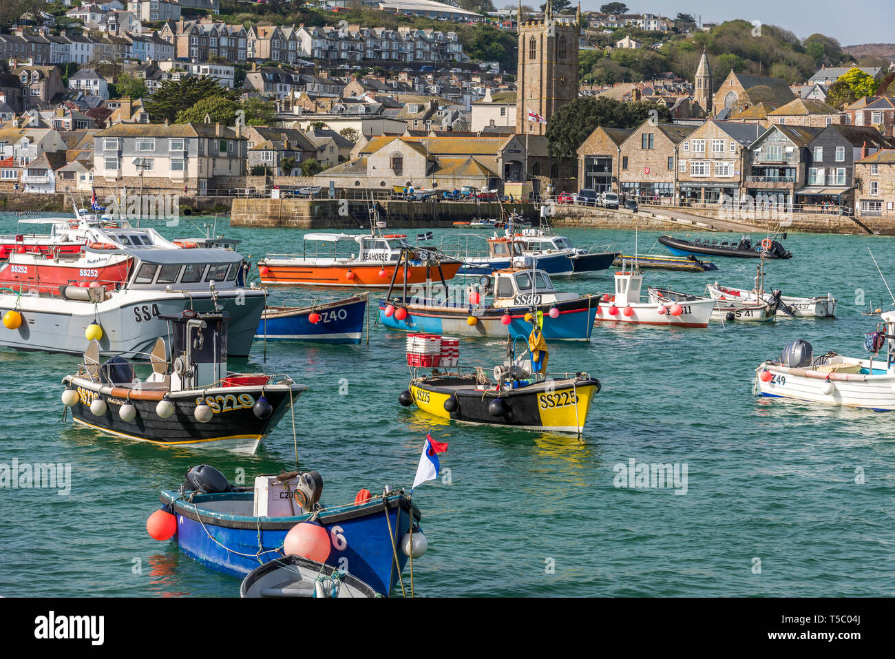 Morning high tide with fishing boats on their moorings in St.ives