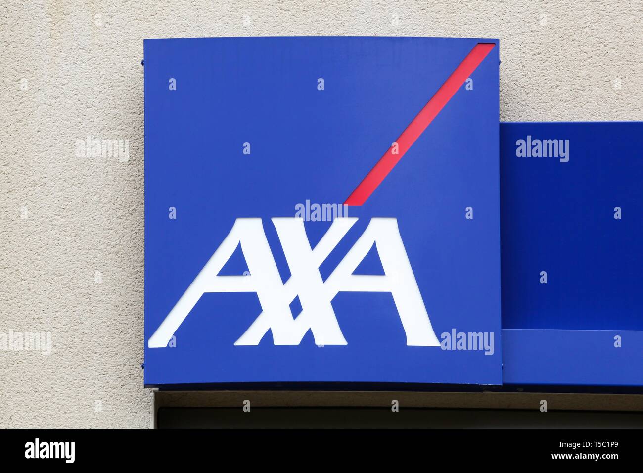 Peronnas, France - April 7, 2019: AXA insurance logo on a wall. AXA is a French multinational insurance firm Stock Photo