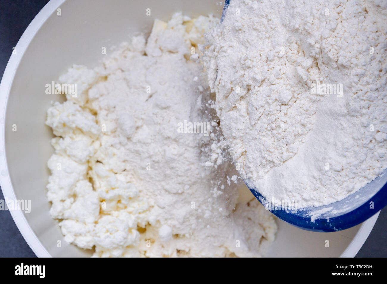 In A Bowl With Ingredients Butter And Cottage Cheese For Biscuits