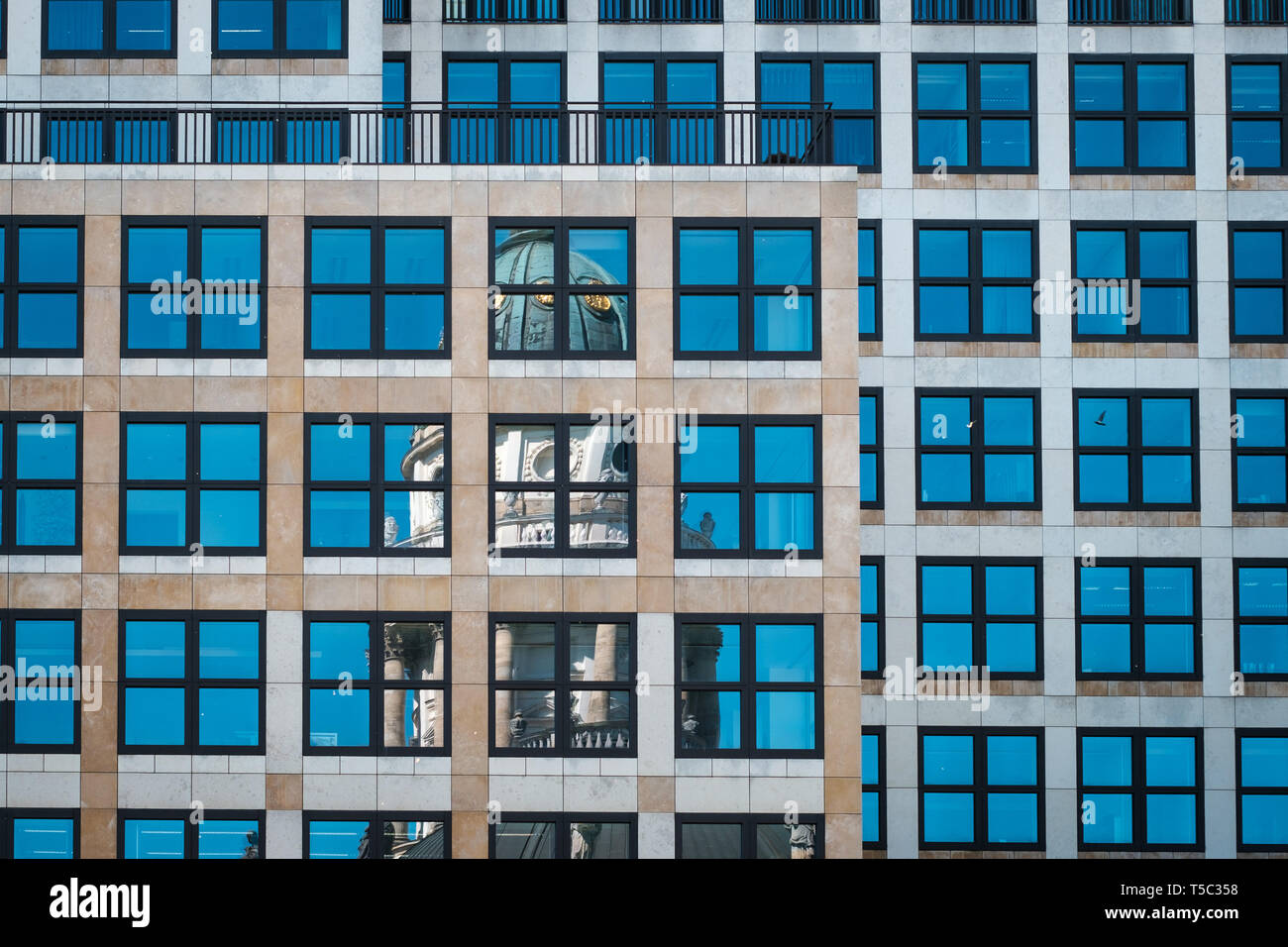 Historic building reflection in window glass facade, Gendarmentmarkt - Stock Photo