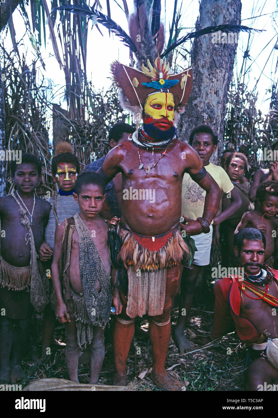 Papua New Guinea. Southern Highlands. Local Huli tribesman with children. Stock Photo