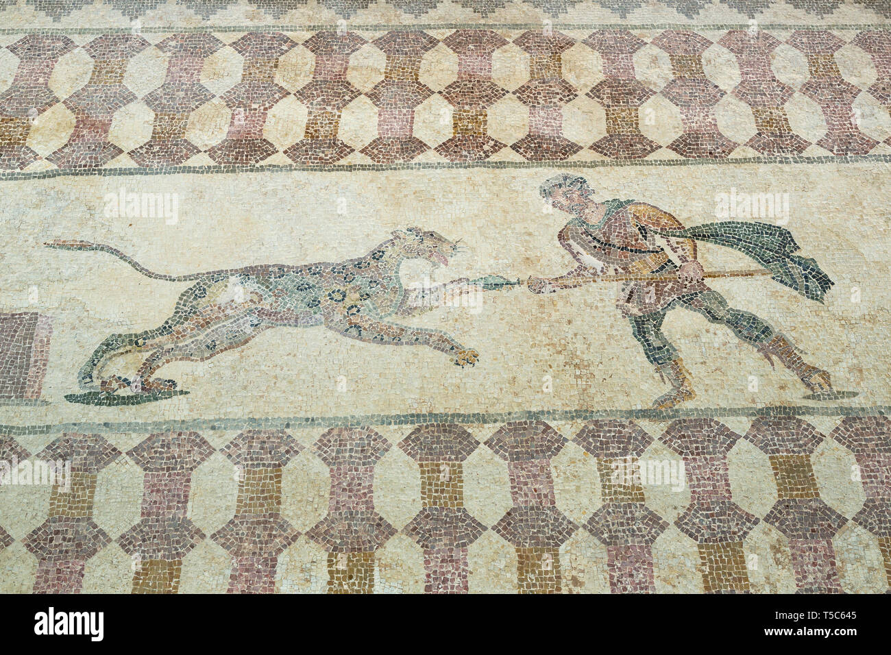 Mosaic depiction of a hunter fighting a leopard, House of Dionysos, Paphos Archaeological Park, Paphos, Cyprus Stock Photo