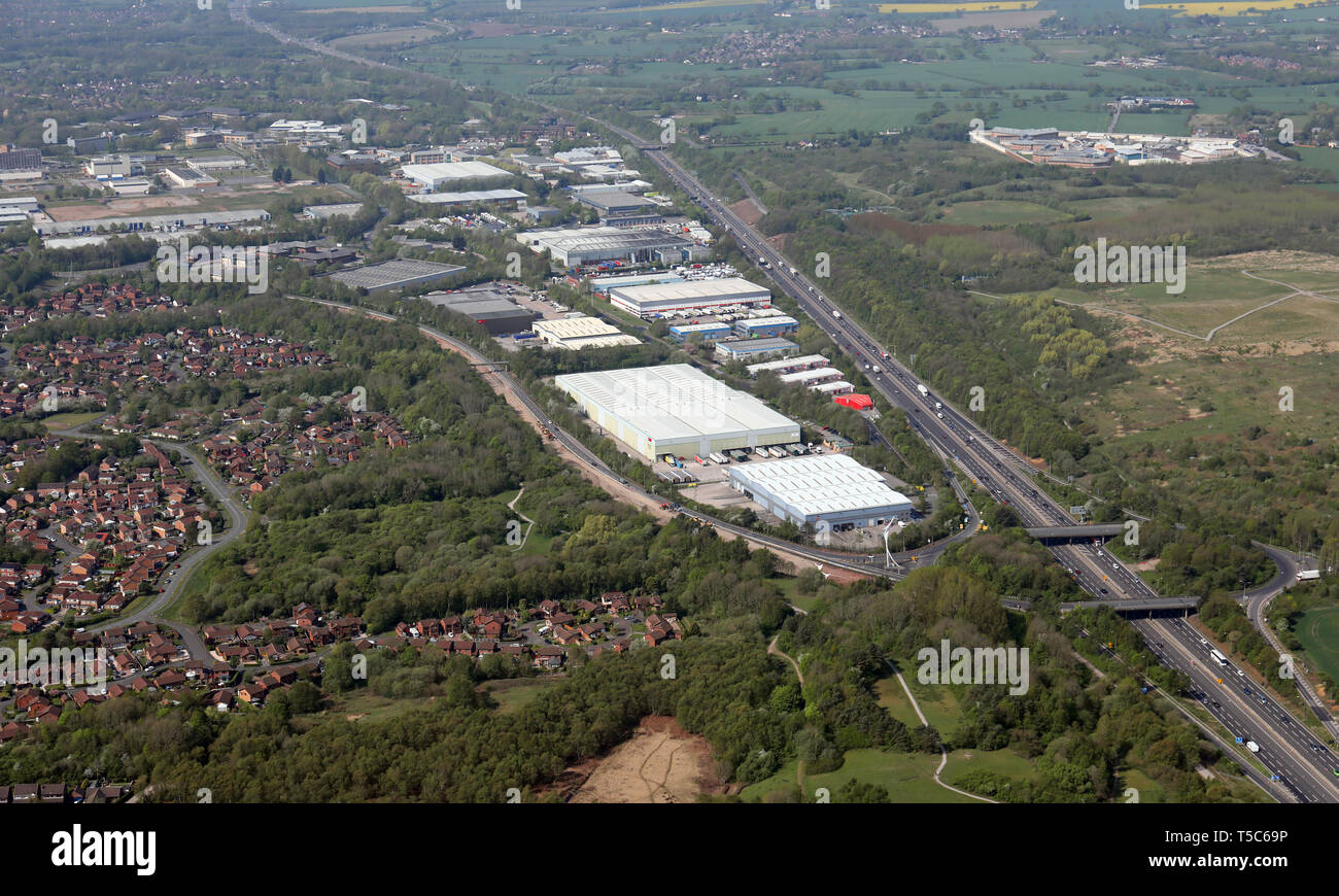 aerial view of Birchwood Technology Park and the M62 motorway at Birchwood, Warrington, showing junction 11 in the right foreground, Cheshire Stock Photo