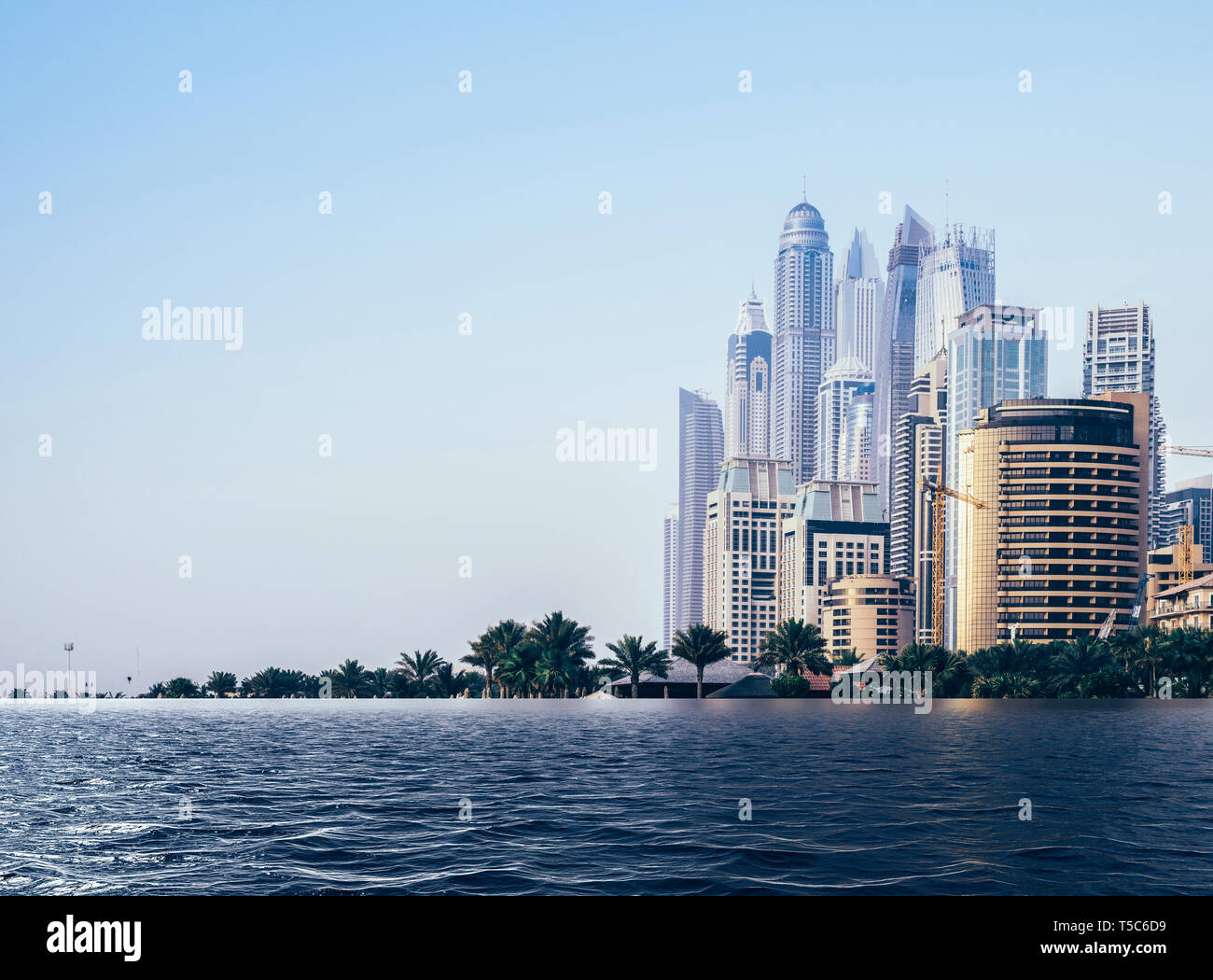 Digital composite of flooded beach at Jumeirah beach in Dubai Marina, UAE - global warming rising sea levels environmental damage concept Stock Photo